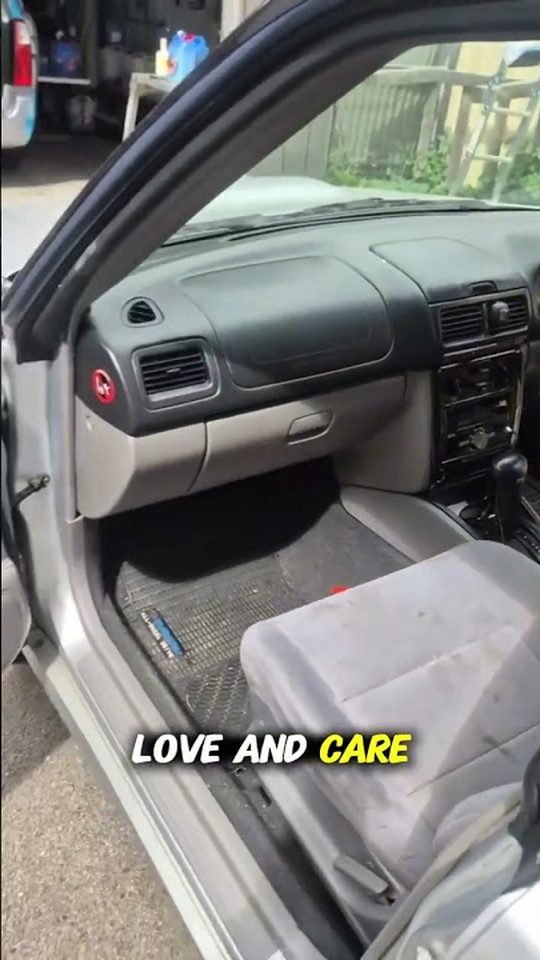 Soiled front seat of a silver car before its Clean Getaway detail